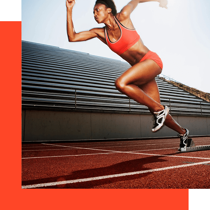 A woman running on the track in an orange bra